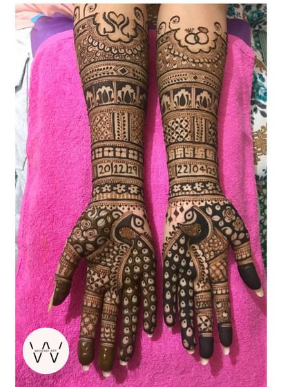 This engagement design is all about celebrating love. The full-arm pattern includes the couple's initials, important dates, and symbols of their union like engagement rings.