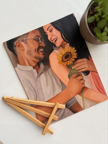 This candid portrait of a couple sharing a happy moment with a sunflower captures a feeling of warmth and affection. It's these genuine emotions I strive to paint.