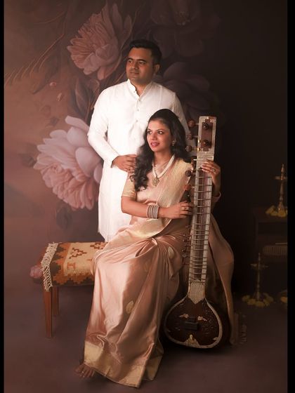We incorporated her love for music into this traditional shoot by including her sitar. It adds such a personal and unique layer to their story, capturing the essence of a new chapter.