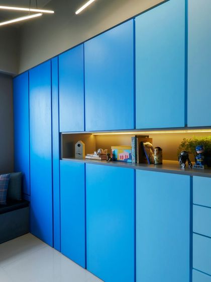Another view of the custom ombre wardrobe, showing how the gradient of blue adds depth and interest to the room.