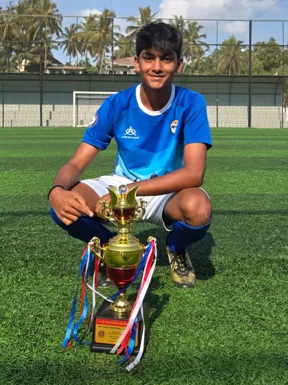 A confident pose from a U14 Tigers player with his trophy.