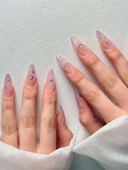 A full view of the celestial-themed nail inspiration, perfect for a dreamy look.