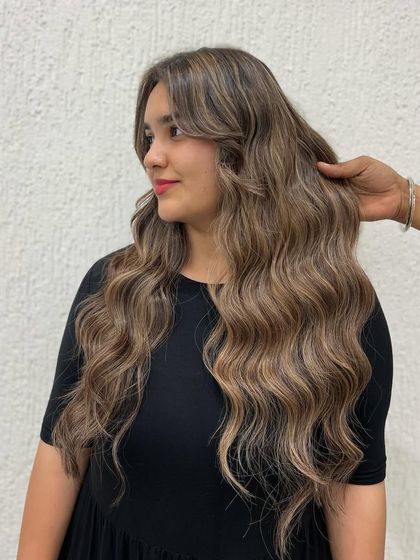 Another angle of this gorgeous cool blonde look. The waves perfectly showcase the multi-dimensional tones in her hair.