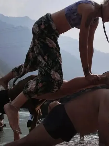 The base of the plank stack is the foundation. It's a powerful demonstration of strength and support in acro yoga.