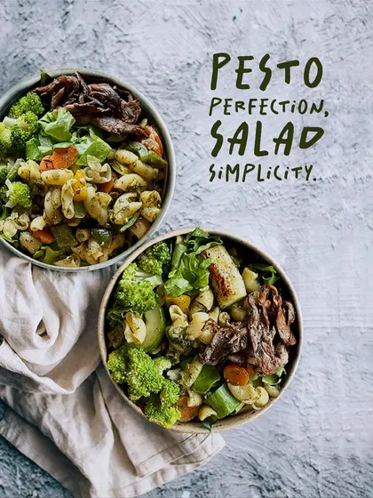 Pesto perfection and salad simplicity. This bowl showcases our delicious pesto pasta salad, made with our freshly prepared pesto sauce, garden vegetables, and your choice of protein.