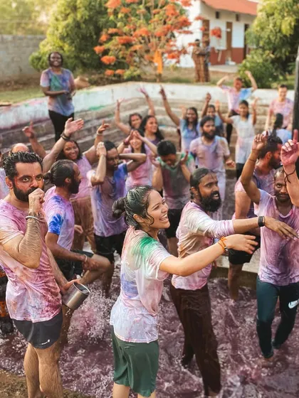 A vibrant and energetic moment from our Holi celebration. The water, colors, and laughter create an unforgettable experience of pure joy.