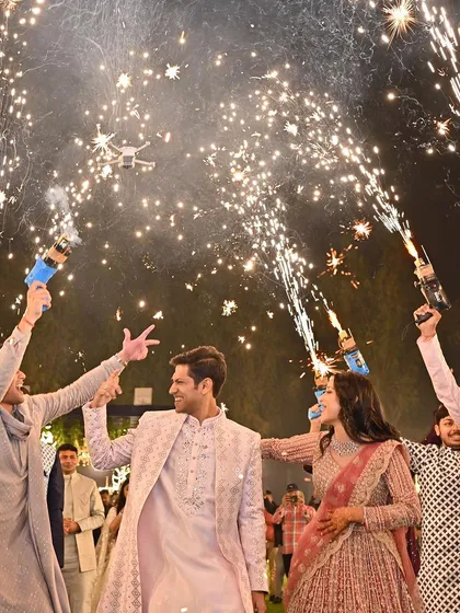 Crafting the perfect couple entry is one of my favorite things to do. Here, we used cold pyro guns to create a spectacular, high-energy welcome for the bride and groom, making them feel like rockstars.