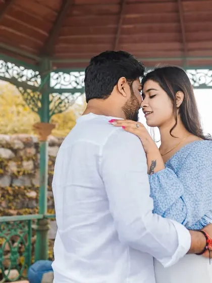 An intimate embrace in the Rishikesh gazebo. The soft light and natural surroundings create a perfect setting for these close-up, emotional portraits that focus on the couple's bond.