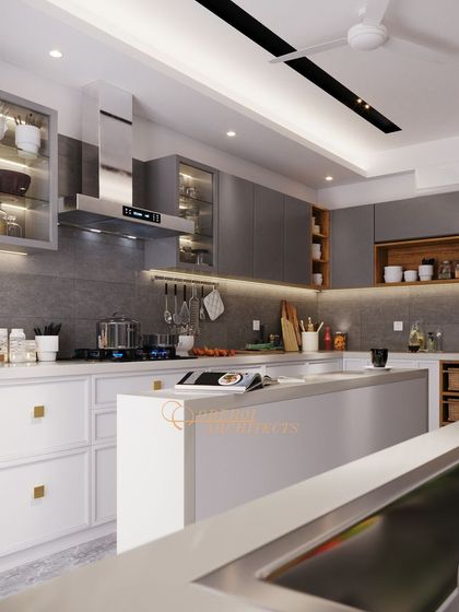 The island provides additional counter space and a casual dining spot. Under-cabinet lighting highlights the workspace and adds a warm glow to the modern design.