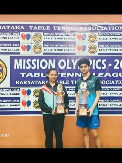 S Kiran Ashish and Sahana H Murthy with their trophies from the Mission Olympics league.