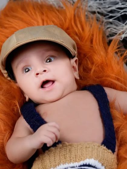 Capturing the curious expressions of a one-month-old baby. This age is full of new awareness, and this portrait perfectly shows off his budding personality.