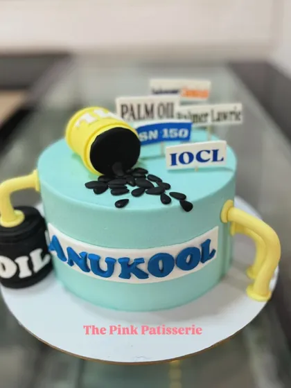 I love a creative challenge, like this themed cake for a company in the oil industry. It features a sculpted oil barrel and pipes, along with logos of associated brands like IOCL, turning a complex concept into a memorable, edible centerpiece.