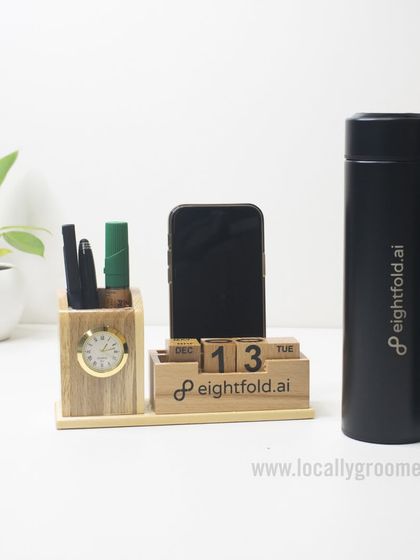 A beautiful desk setup featuring our customizable wooden desk organizer and a branded thermal flask for eightfold.ai. These items combine natural materials with modern utility.