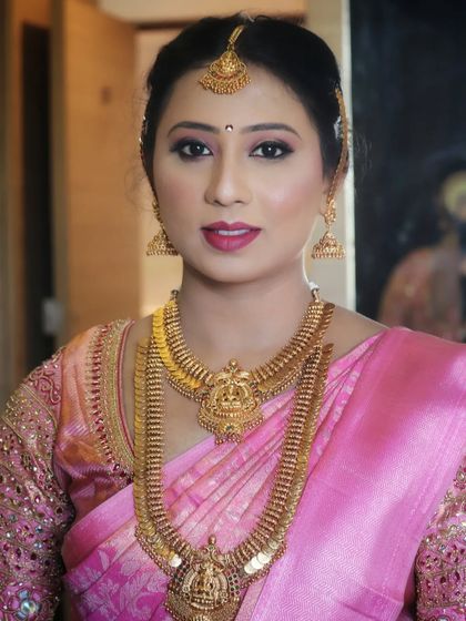 A portrait of a beautiful bride. Her makeup is elegant and timeless, with a focus on enhancing her features to create a look that is both traditional and sophisticated.