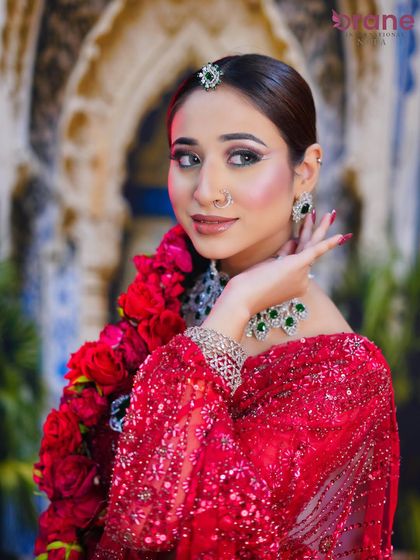This angle shows the beautiful side profile and the detailed hair and makeup work, essential for a 360-degree bridal look.
