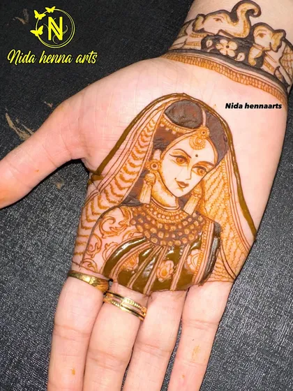 A close-up of the matching bride portrait for the groom in the previous image. The focus here is on the jewelry, the drape of the dupatta, and her serene expression.