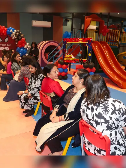 It's fun for everyone, including the adults. Moms get into the party spirit, enjoying a game of musical chairs alongside the kids.