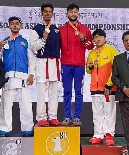 A proud moment for the academy and for India. My students, Tushar and Harshit, on the winners' podium after securing gold medals at the 8th South Asian Karate Championship in Bhutan. We don't just compete; we win.
