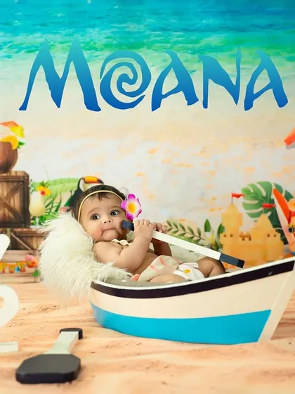 Halfway to one with a Moana-themed adventure. This setup includes a boat, sandy beach, and familiar characters for a fun-filled session.