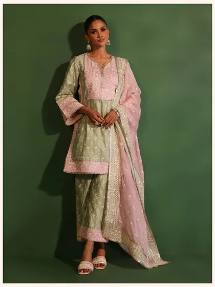 This unique green and pink kurta set is a perfect example of my playful approach to color. It’s a festive outfit that is sure to get you noticed.