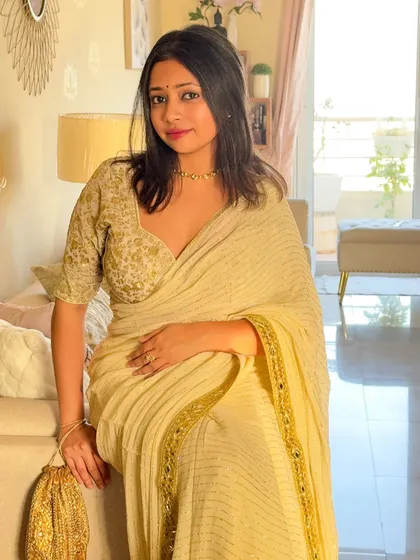 Golden hour in a beautiful golden-hued saree. I revamped this saree from my trousseau by pairing it with a different blouse, showing how easy it is to create a new look with existing pieces.