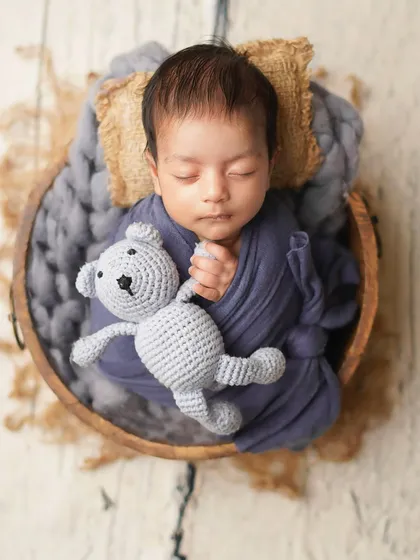 A close-up of the newborn and his teddy bear, showing the sweet detail of his hand resting on his friend. These are the little stories I love to capture.