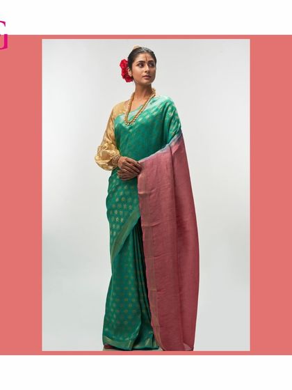 Another view of the emerald green and rose silk linen saree, showcasing its rich colors and beautiful texture.