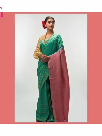 This elegant green silk linen saree features a contrasting pink pallu, offering a fresh and sophisticated color story within the Aadya collection.