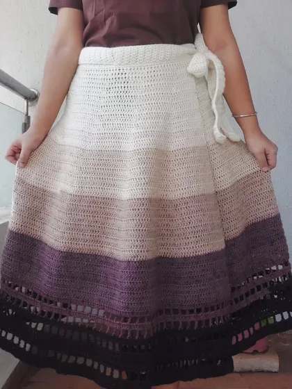 This is the Colosseum Wrap Skirt, a beautiful and easy-to-wear piece with a gradient color scheme and a unique wrap design.