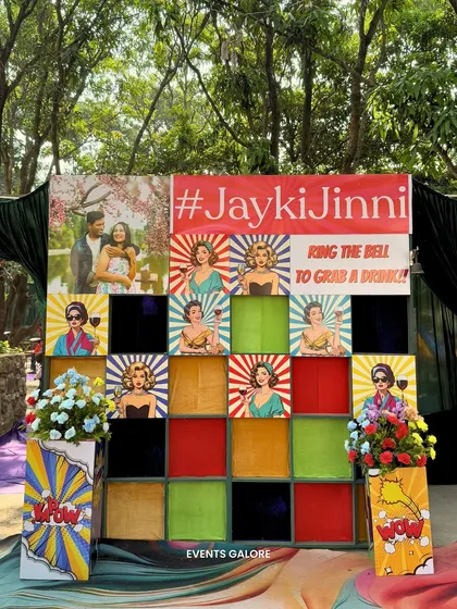 An interactive drink wall designed for the carnival theme. Guests could "ring the bell to grab a drink" from the colourful cubby holes, adding a playful element to the bar service.