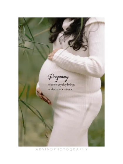 A simple, elegant profile shot focusing on the beauty of the baby bump. Dressed in a form-fitting white sweater, this image is a classic and graceful way to celebrate the miracle of pregnancy.