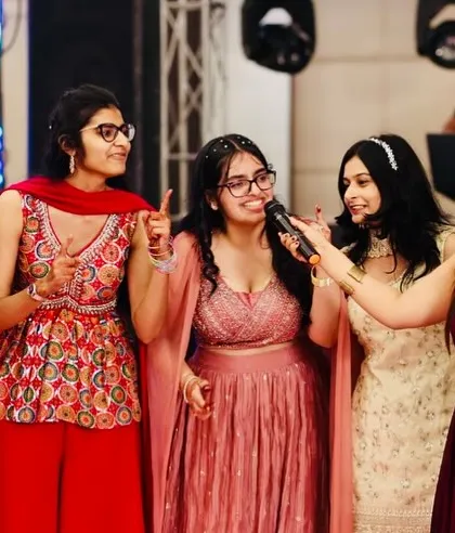 Getting into the crowd and interacting with the bridesmaids during a Sangeet. It's all about making sure everyone feels included in the fun.