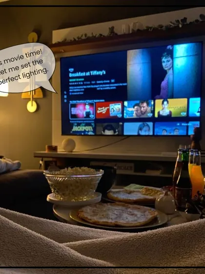 It's movie time! Your smart home knows to dim the lights to create the perfect cinematic experience, so you can focus on the popcorn and the film.
