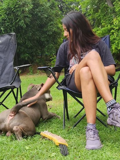 A moment of connection. A simple pat and quiet time reinforces our bond outside of the formal training structure. This is the foundation of our partnership.