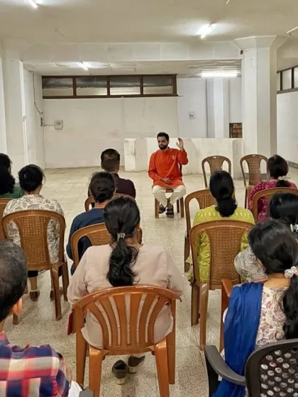 An engaged audience during a corporate wellness lecture at National Insurance. Our sessions are not just physical practices but also educational forums where we discuss the science behind stress management and mental well-being in a corporate context.