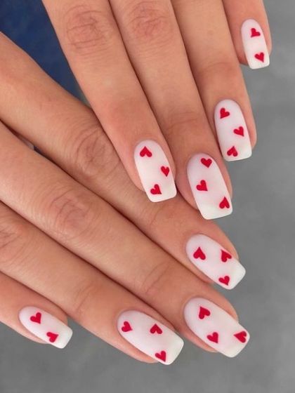 A matte white base makes these little red hearts pop. This is a clean, modern, and romantic design that looks stunning on square-shaped nails.