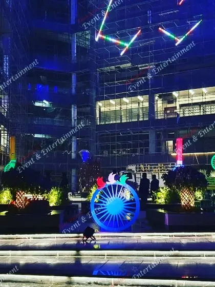 I can transform large outdoor spaces for national celebrations. Here, I used custom lighting fixtures and large Ashoka Chakra installations to create a powerful and patriotic display for an Independence Day event at a corporate campus.