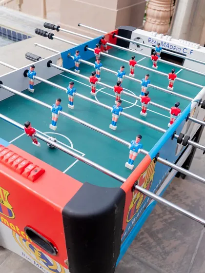 A foosball table for guest entertainment. I believe in incorporating fun games and activities to keep the energy high.