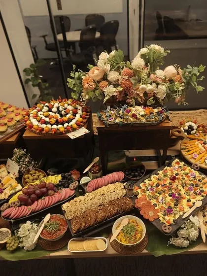Another angle of the stunning grazing table, showing the careful placement of each item to create a visually balanced and appetizing display.