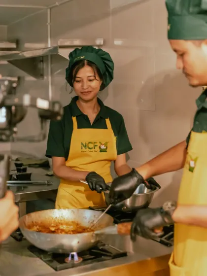 A glimpse of the NCF family in our kitchen. We pour our hearts into every dish, ensuring you get fresh, clean, and lovingly prepared home-style food every time.