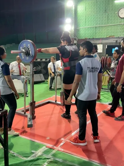 Pooja setting up for a squat at the National Open Championship. She suffers from Thoracic Endometriosis, which causes significant pain and breathing difficulty. We work around her health, managing her training to allow her to compete at the highest level.