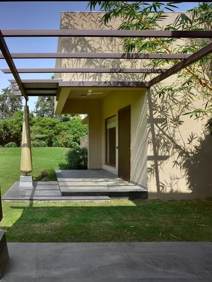 The play of shadows from a pergola on the wall of C Farm. I often use architectural elements like pergolas to create dynamic, changing patterns of light, adding a layer of visual interest that shifts throughout the day.