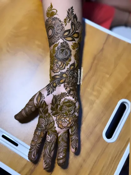 This single-hand design is packed with detail, from shaded roses to delicate leaves and spirals. It demonstrates how even a smaller piece can have a big impact.