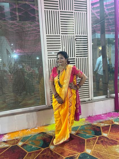 A client looking radiant in a yellow Nauvari at a wedding. This is a popular choice for Haldi functions and other ceremonies.