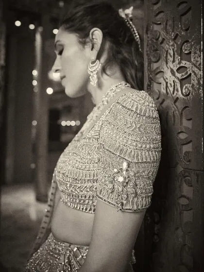 A beautiful black and white shot that focuses on the texture and detail of the Abu Jani Sandeep Khosla lehenga blouse.
