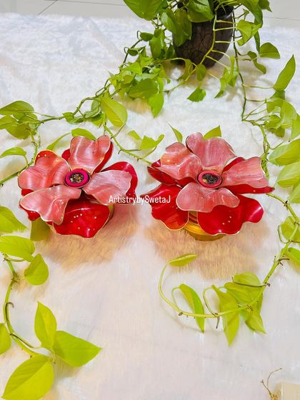 A pair of my trending 3D resin flower diyas. These versatile pieces can be used as T-light holders, candle stands, or dhoop batti holders.