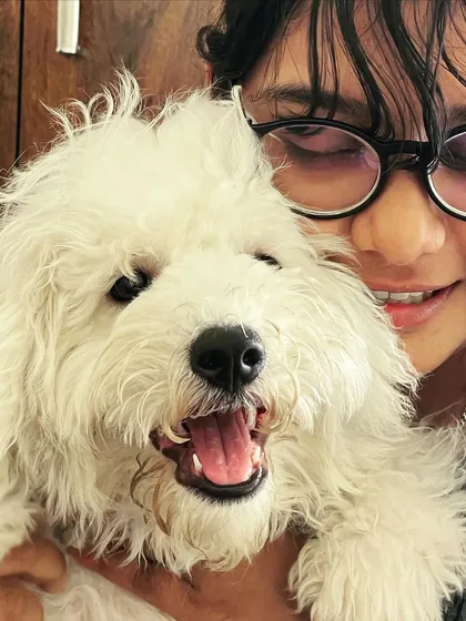 This is one of us with the adorable Snowy. We are always around to give cuddles and make sure your dog never feels lonely. Seeing them happy and comfortable is the best part of our day.