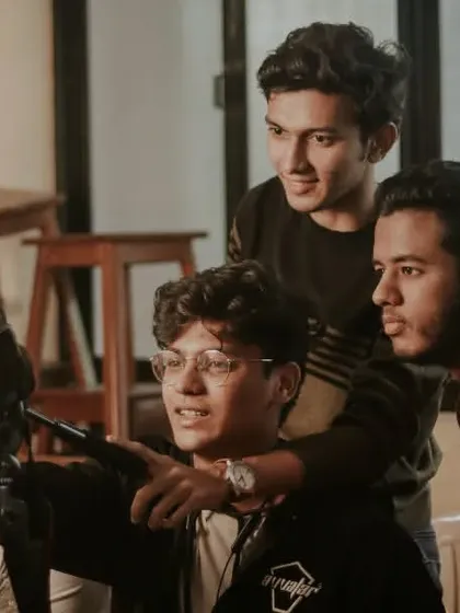 My team and I reviewing footage on the camera monitor during a shoot, making sure we've captured the moment perfectly.