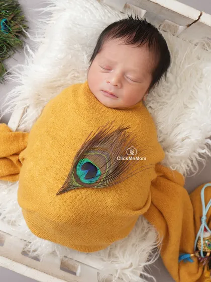 A peaceful portrait of our baby Kanha, snugly wrapped and dreaming sweet dreams. I focus on creating a calm atmosphere to capture these serene expressions.