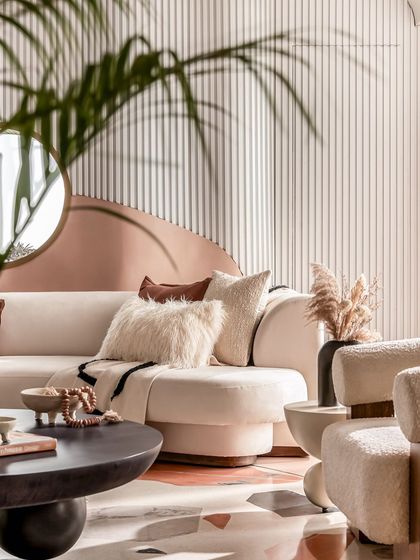 Another view of the living room, showcasing the rich textures and soft, curved forms that define the "Marshmallow" project.